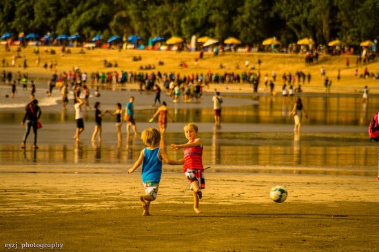 Playing soccer game in the beach