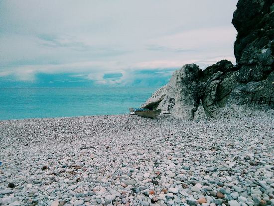 Kolbano Beach with colorful pebble sand